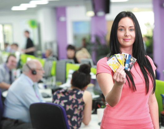 A girl showing multiple cards
