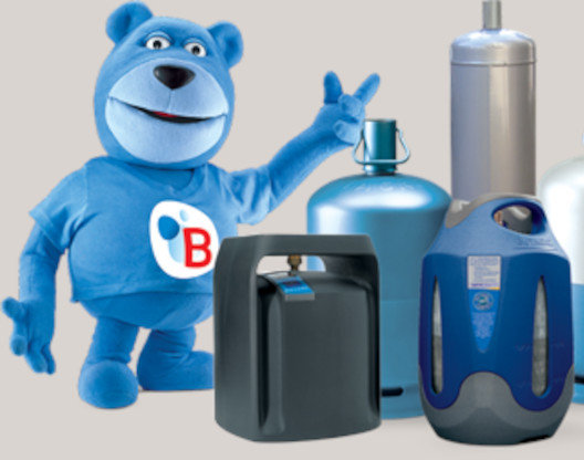 A teddy bear with few containers