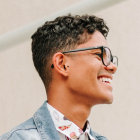 A handsome boy wearing sunglass smiling